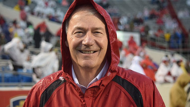 Governor braving weather before kickoff of Hogs-Rebels