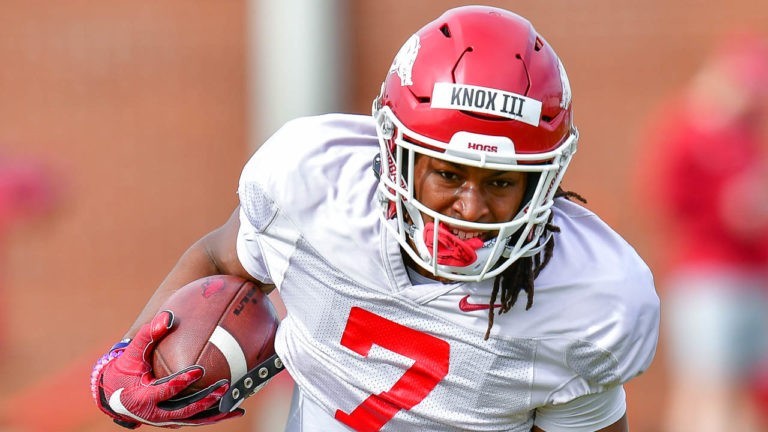 Knox goes against trend in college sports, staying with Hogs