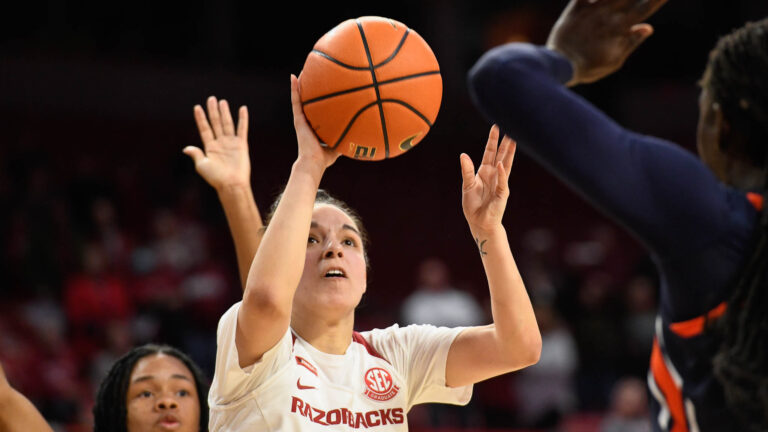 Amber Ramirez after hitting game-winning shot against Auburn with Emrie Ellis