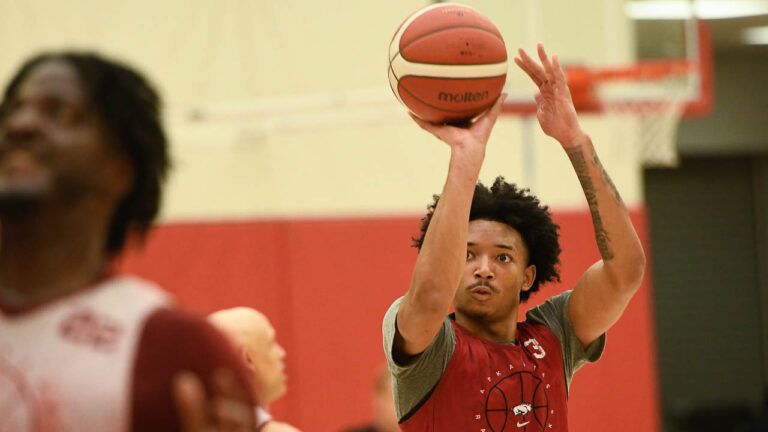 Hogs’ Nick Smith, Anthony Black, Trevon Brazile after practice Wednesday