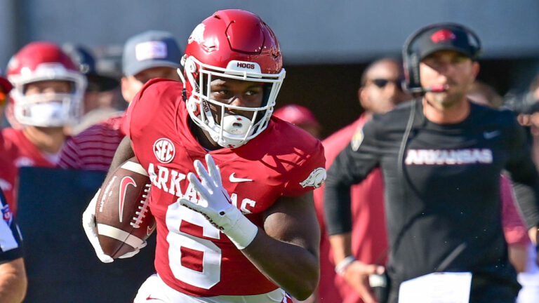 Hogs find way to win in three overtimes over Kansas