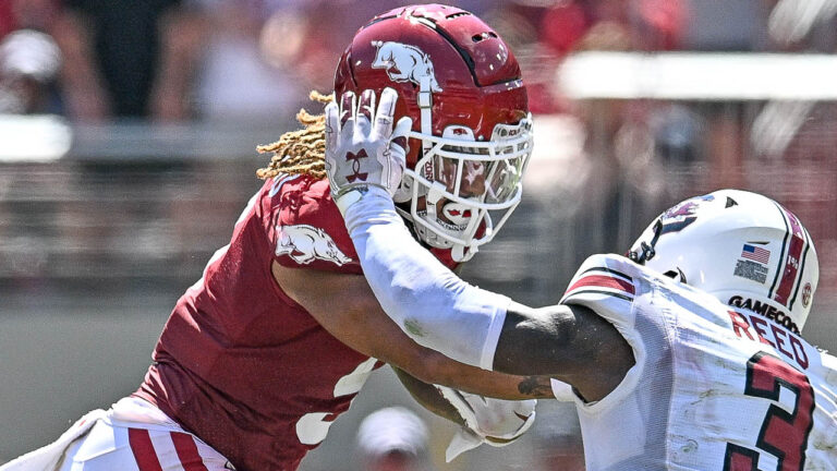 How high did Hogs jump in AP poll after first SEC win?