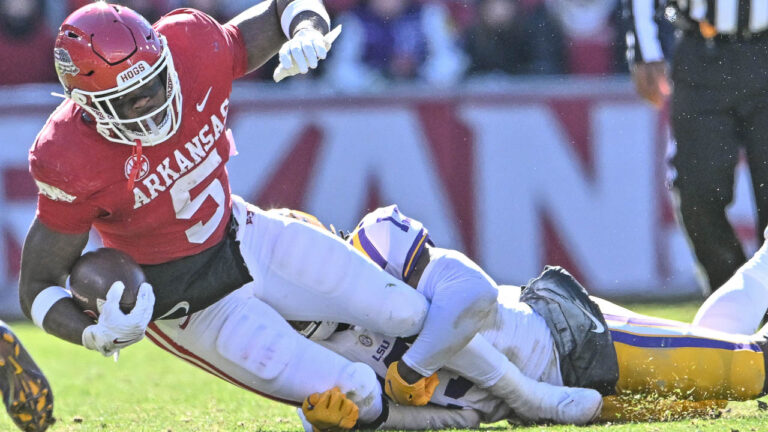 Hogs’ running back Raheim Sanders, center Ricky Stromberg