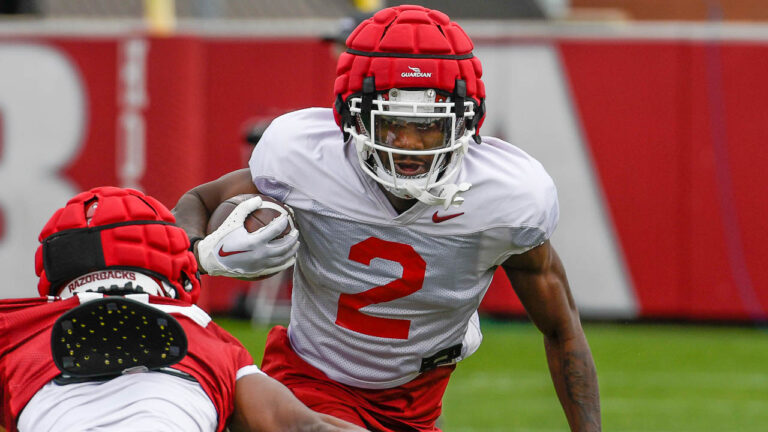 Isaac TeSlaa, Andrew Armstrong after Hogs’ practice on Thursday