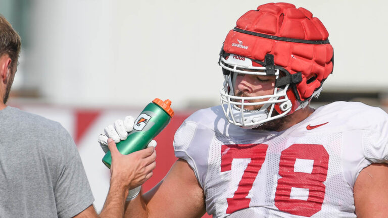 Razorbacks offensive lineman Joshua Braun, wide receiver Isaac TeSlaa