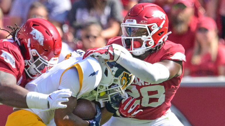 Razorbacks’ defensive players Trajan Jeffcoat and Jaheim Thomas after win