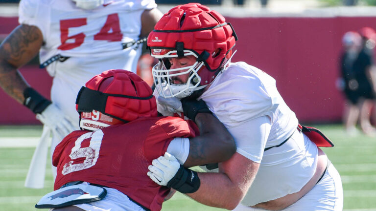 Razorbacks’ Larry Worth, Addison Nichols after Friday morning practice
