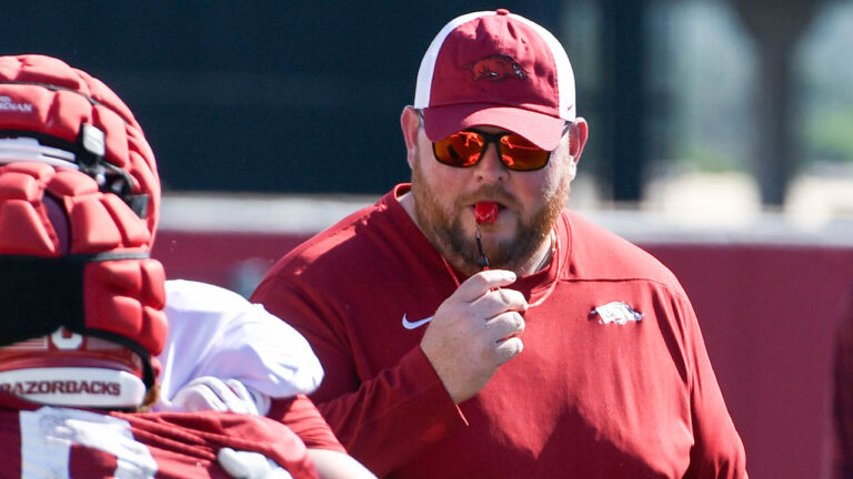 Razorbacks’ offensive line coach Eric Mateos after Saturday practice