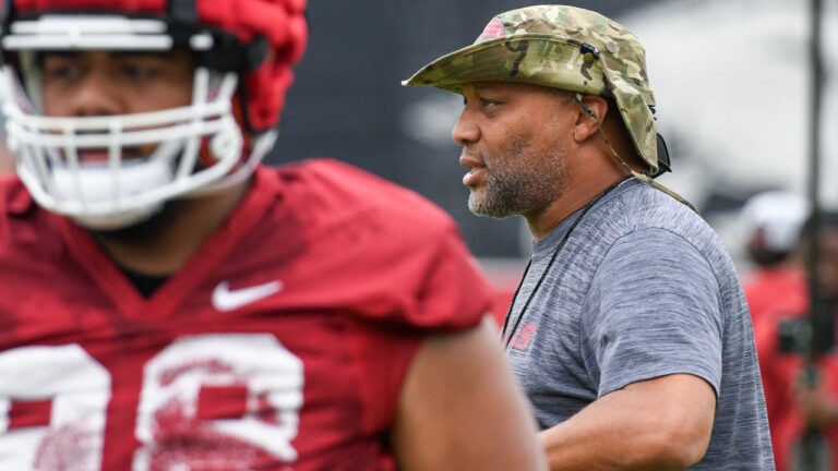 Razorbacks defensive line coach Deke Adams after practice