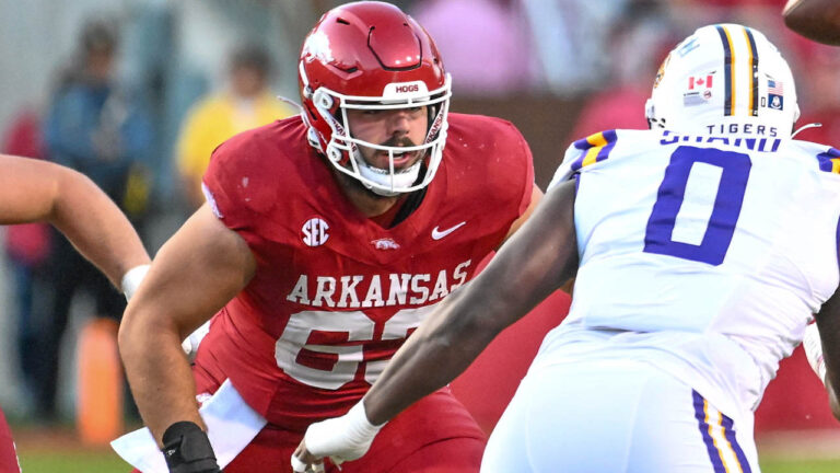 Hogs’ offensive lineman Addison Nichols, linebacker Larry Worth after practice