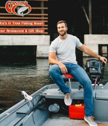 Clint Gaston driving the boat outside the resort