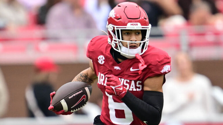 Razorbacks receiver Isaiah Sategna turns up field after making a catch against Ole Miss