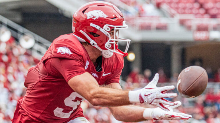 Razorbacks tight end Luke Hasz reaches out to make a catch against Ole Miss