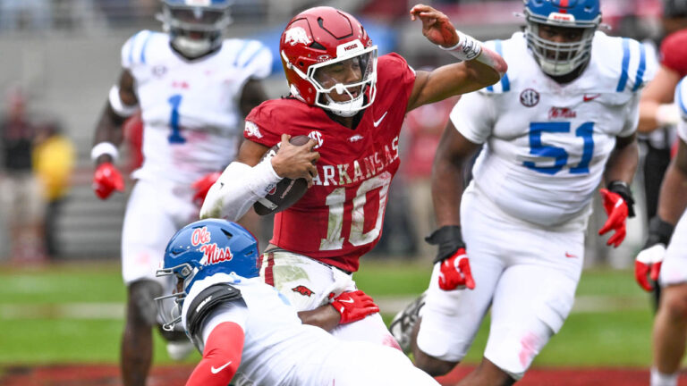 Razorbacks quarterback Taylen Green scrambling against Ole Miss