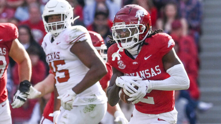 Razorbacks wide receiver Andrew Armstrong running after making a catch against Texas