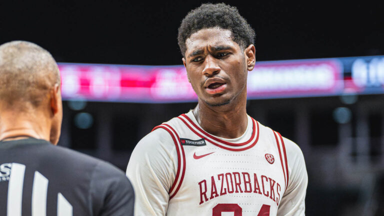 Razorbacks forward Billy Richmond II talks with official against Illinois