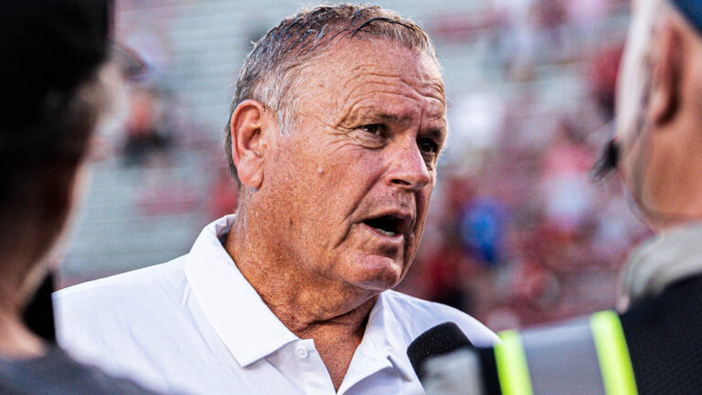 Razorbacks coach Sam Pittman at halftime with SEC Network reporter against UAB