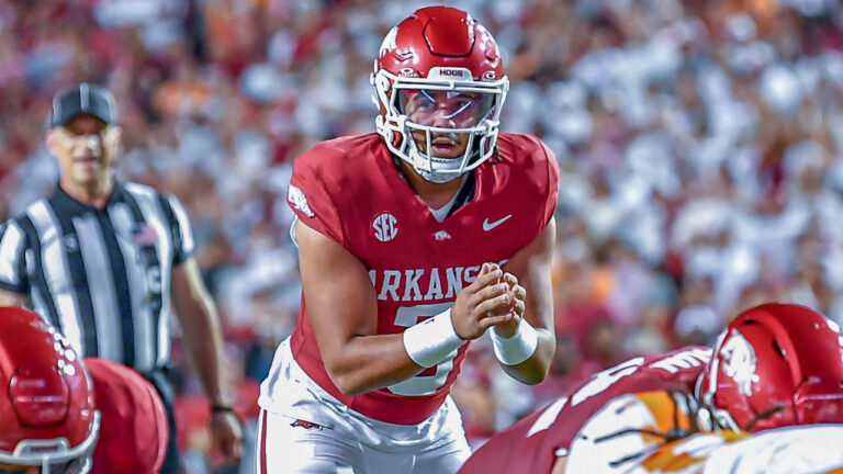 Razorbacks quarterback Malachi Singleton taking a snap from center against Tennessee