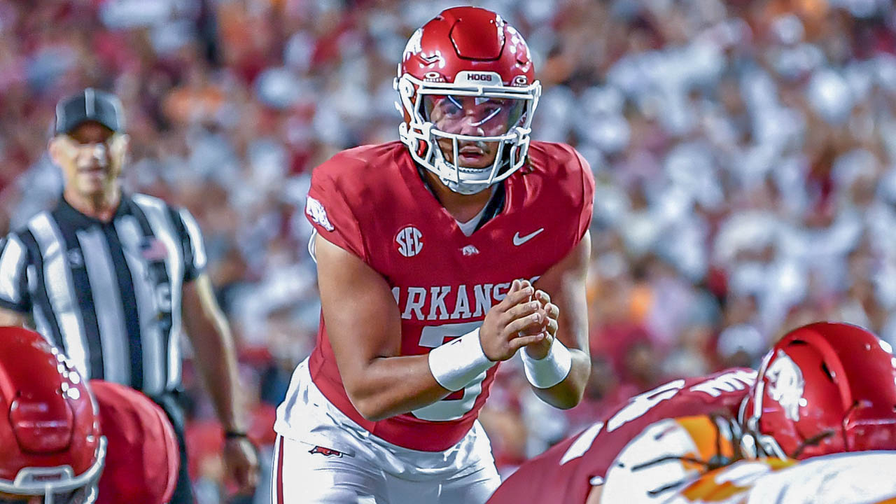 Razorbacks quarterback Malachi Singleton taking a snap from center against Tennessee