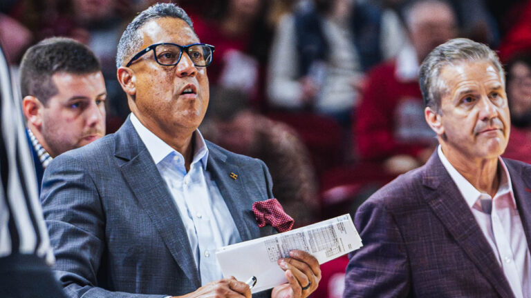 Razorbacks assistant Chuck Martin on the sidelines with coach John Calipari