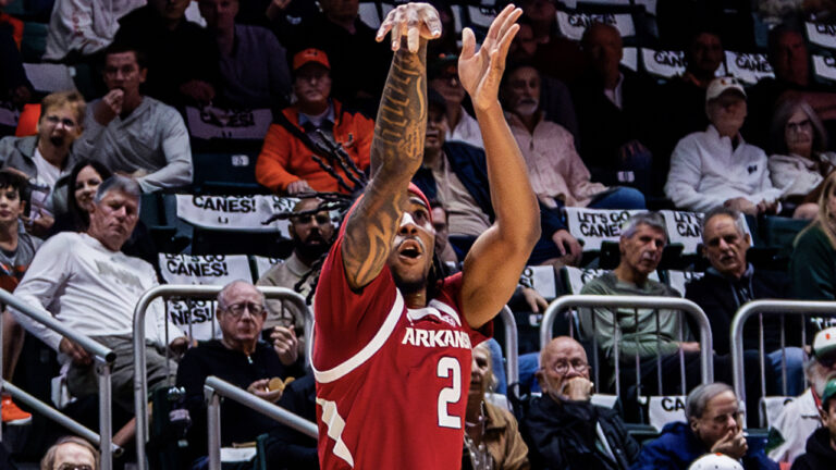 Razorbacks guard Boogie Fland puts up a shot against Miami