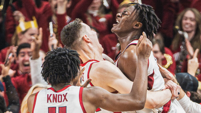 Razorbacks forward Adou Thiero celebrates with teammates after beating Georgia