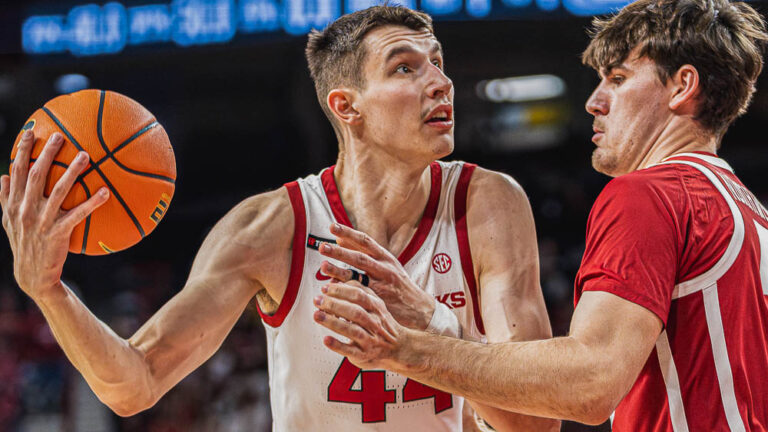 Razorbacks forward Zvonimir Ivisic battles against Oklahoma