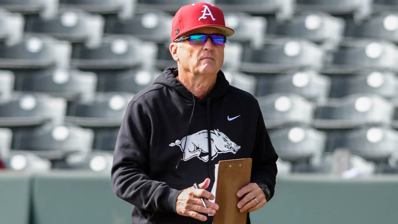 Razorbacks coach Dave Van Horn walks to the pitcher's mound during a scrimmage