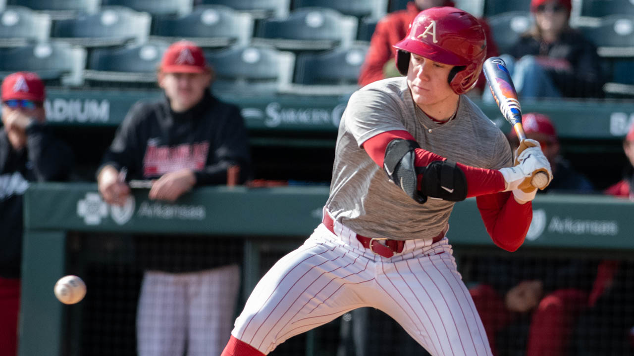 Razorbacks outfielder Charles Davalan looks at a pitch coming in during preseason scrimmage
