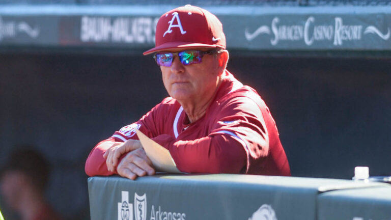 Razorbacks coach Dave Van Horn in the dugout in game against Grambling