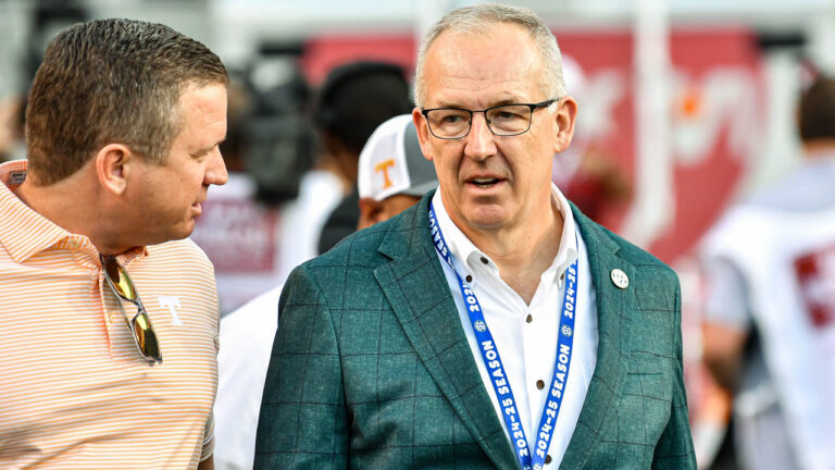 SEC commissioner Greg Sankey on the field before Arkansas' game with Tennessee
