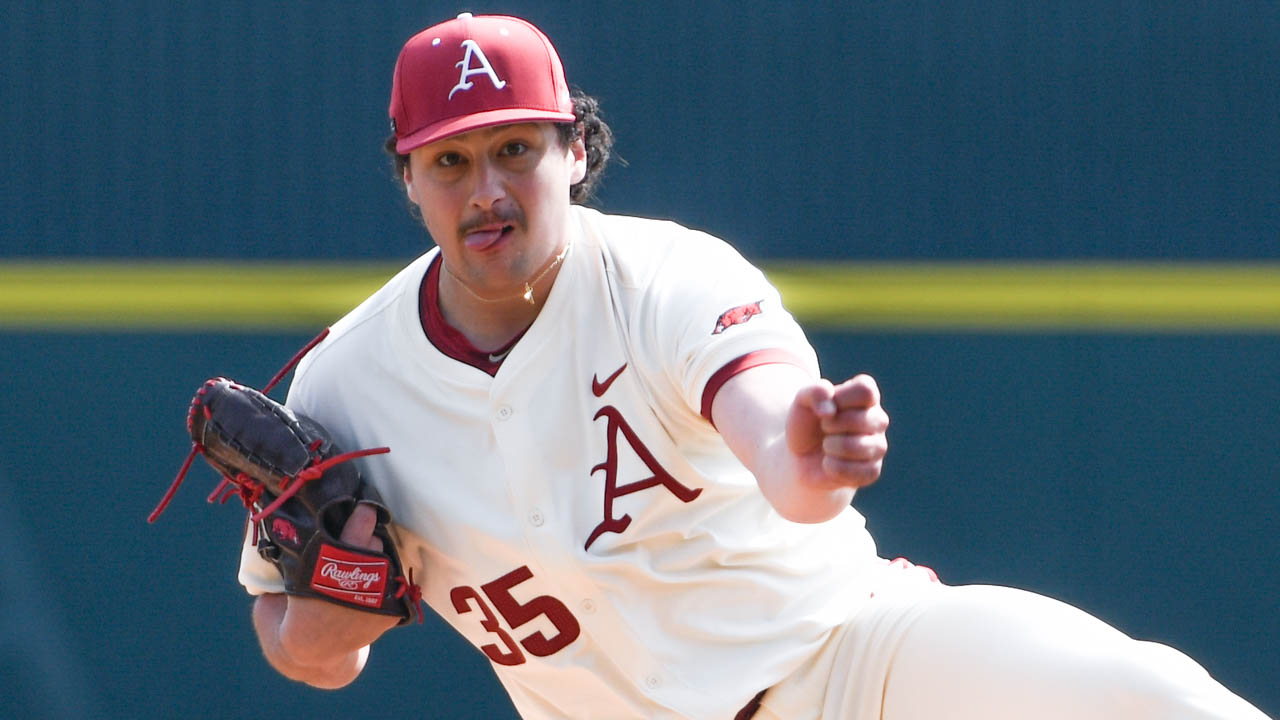 Razorbacks pitcher Landon Beidelschies delivers a pitch against Charlotte