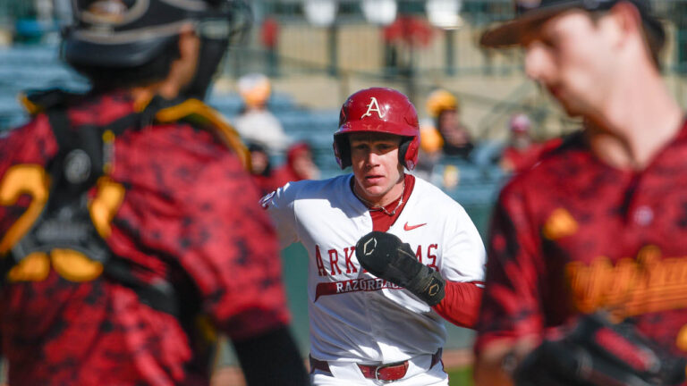 Razorbacks outfielder Charles Davalan runs down the line against Louisiana-Monroe