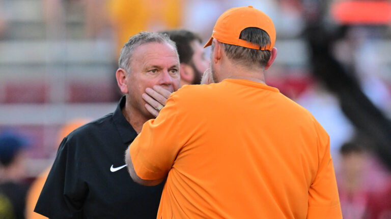 Razorbacks coach Sam Pittman with Tennessee coach Josh Heupel