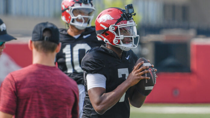 Arkansas Razorbacks quarterback KJ Jackson looks to make a pass during Sunday morning's practic