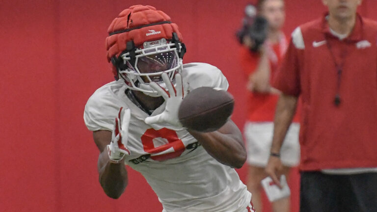 Razorbacks’ O’Mega Blake, Monte Harrison, Raylen Sharpe after practice