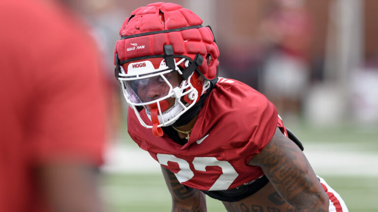 Razorbacks’ Caleb Wooden, Larry Worth, Miguel Mitchell after practice