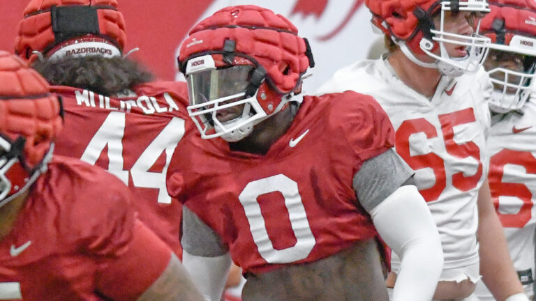 Razorbacks defensive linemen Justus Boone, Cam Ball after practice