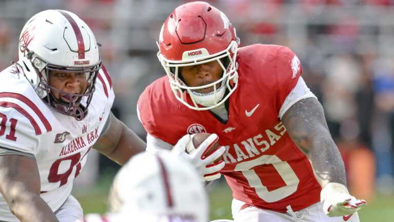 Razorbacks’ running back Braylen Russell, offensive lineman Kobe Branham