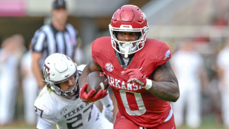Razorbacks running back Braylen Russell, lineman E’Marion Harris on offense