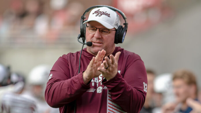 Texas A&M Aggies coach Mike Elko on the sidelines in a game against the Arkansas Razorbacks