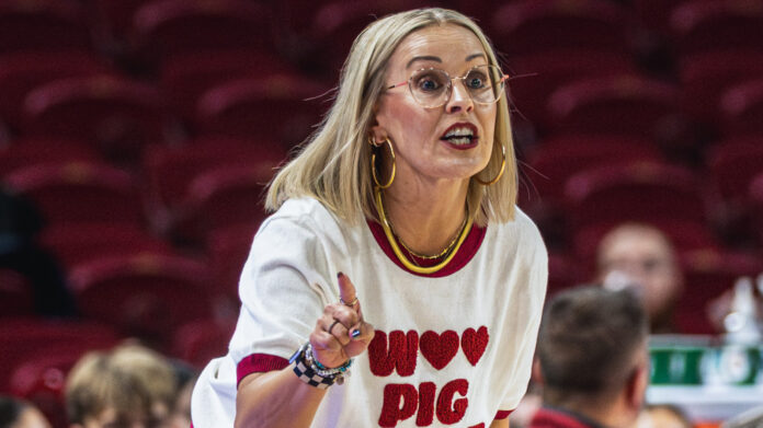 Arkansas Razorbacks coach Kelsi Musick on the sidelines in an exhibition game against Arkansas-Fort Smith
