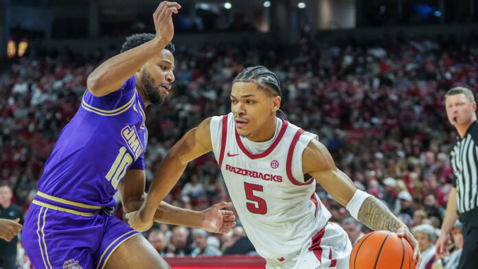 Arkansas Razorbacks guard Darius Acuff, Jr., driving against the James Madison Dukes