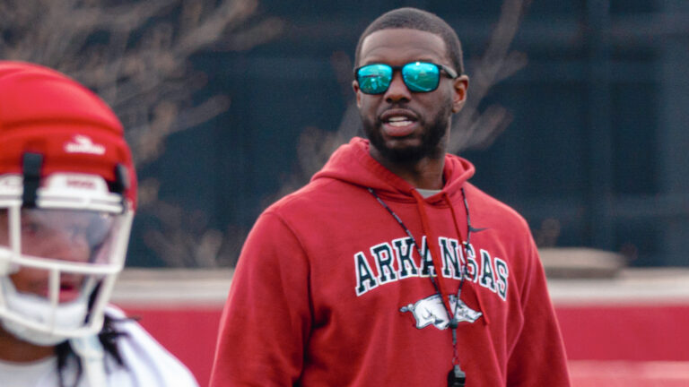 Razorbacks’ wide receiver coach Larry Smith, quarterbacks coach Mitch Stewart