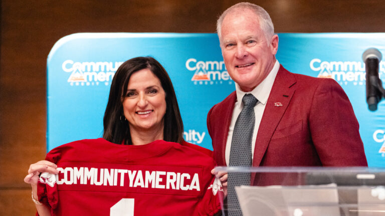 CommunityAmerica's Lisa Ginter and Arkansas athletic director Hunter Yurachek