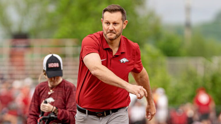 Arkansas Razorbacks coach Ryan Silverfield throwing out first pitch at baseball game against Georgia