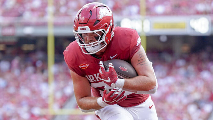 Arkansas Razorbacks receiver Max Adcock scores during game against North Alabama at Razorback Stadium