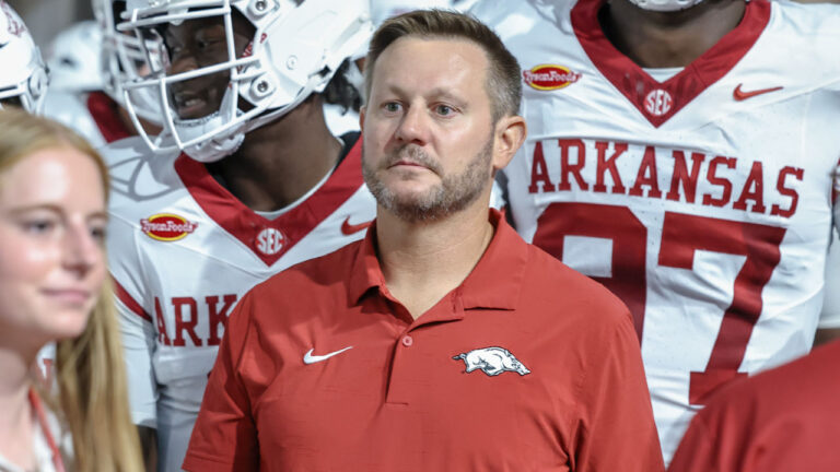 Arkansas Razorbacks coach Ryan Silverfield coming on the field before playing the Utah Utes