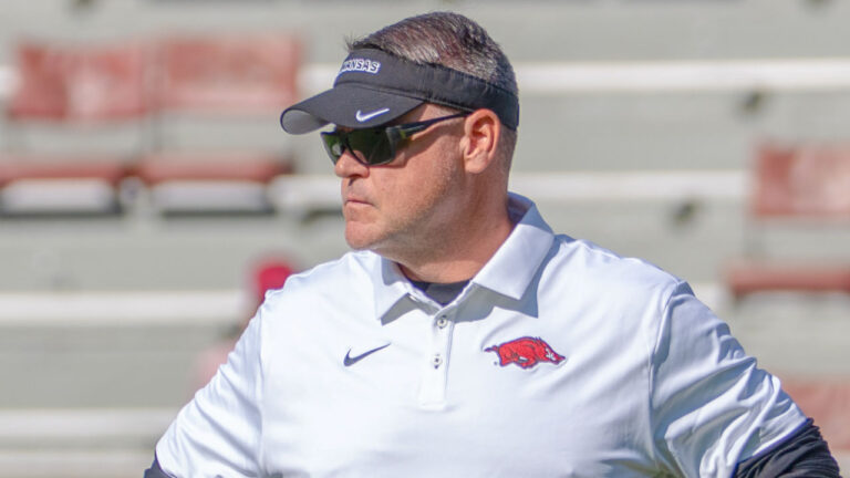 Arkansas Razorbacks offensive coordinator Tim Cramsey in pregame warmups before game against the Georgia Bulldogs at Razorback Stadium