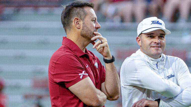 Arkansas Razorbacks coach Ryan Silverfield on the field before game against the Tulsa Golden Hurricane in Razorback Stadium